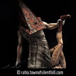 Red Pyramid Thing & Lying Figure Statue