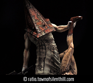 Red Pyramid Thing & Lying Figure Statue